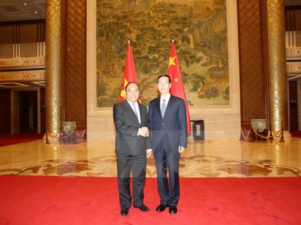 В Пекине состоялись переговоры между замглавы правительства СРВ и вице-премьером Госсовета КНР - ảnh 1